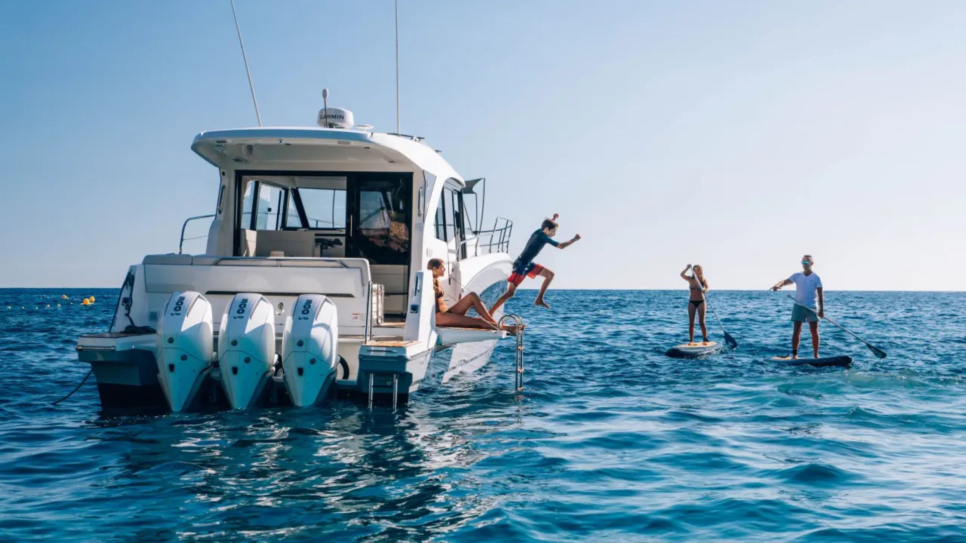 Beneteau Antares 12 Coupe on water - jumping in